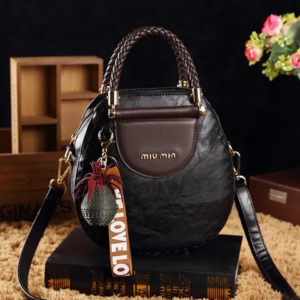 Oval Shape Ladies Miv Min Bag. (Brown Color.)